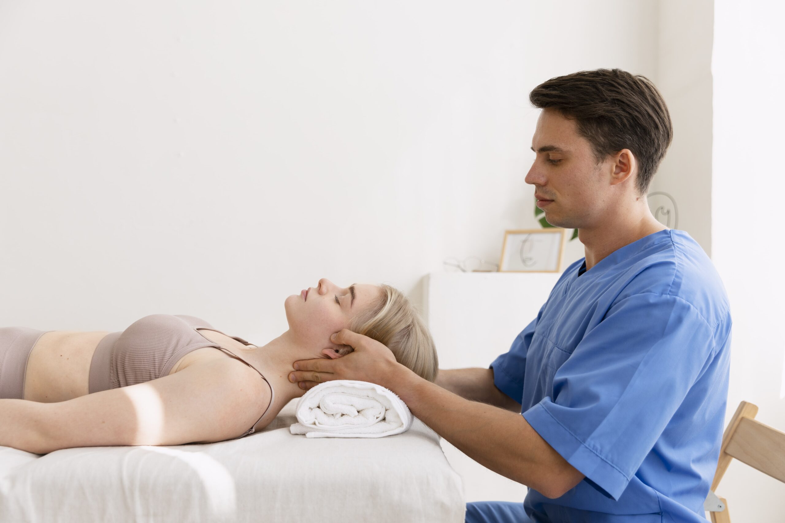 nurse-with-patient-osteopathy-session-min